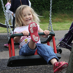 Photo of little girl on swing
